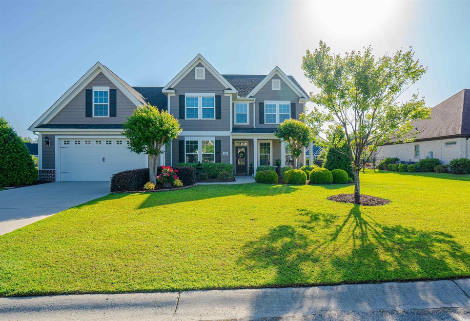 Craftsman-style house featuring an attached garage