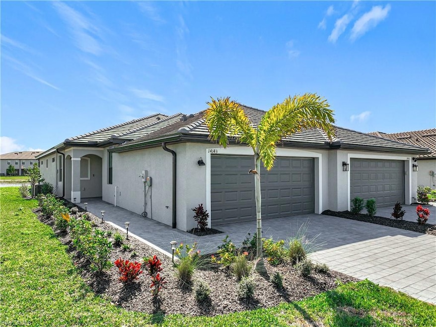 View of property exterior featuring a garage