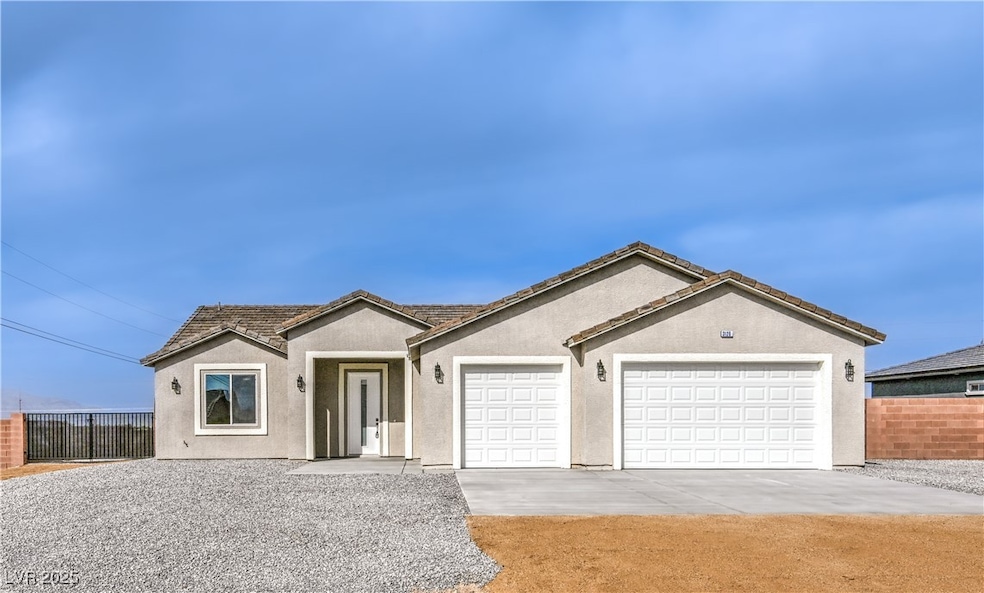 Ranch-style house featuring driveway, stucco sidin