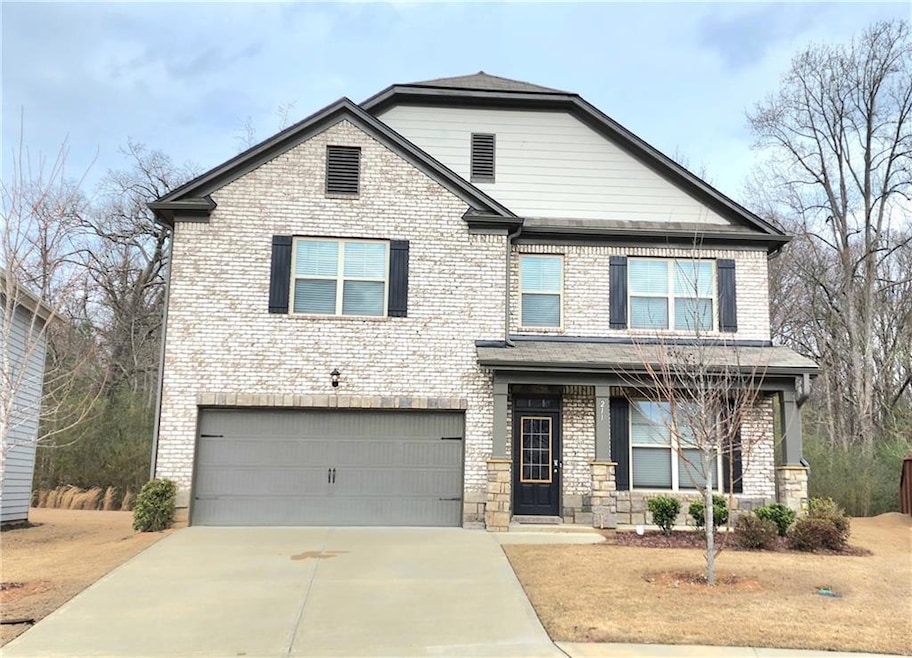 View of front of property with a garage
