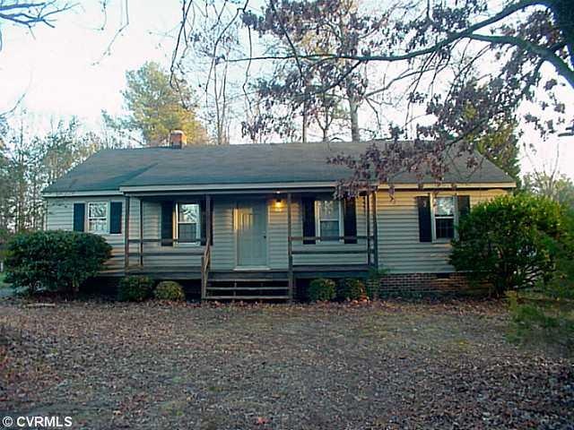 Exterior Front - Front view of vinyl-sided ranch.