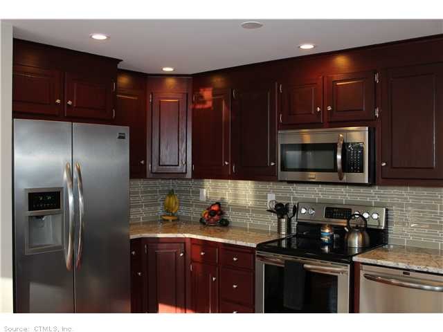 Kitchen. High end appliances, lovely glass tile ba