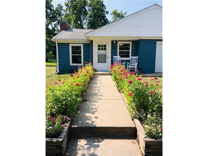 Beautiful zinnias line the sidewalk to your new ho