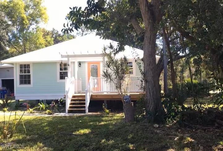 View of front of house with a nice deck.
