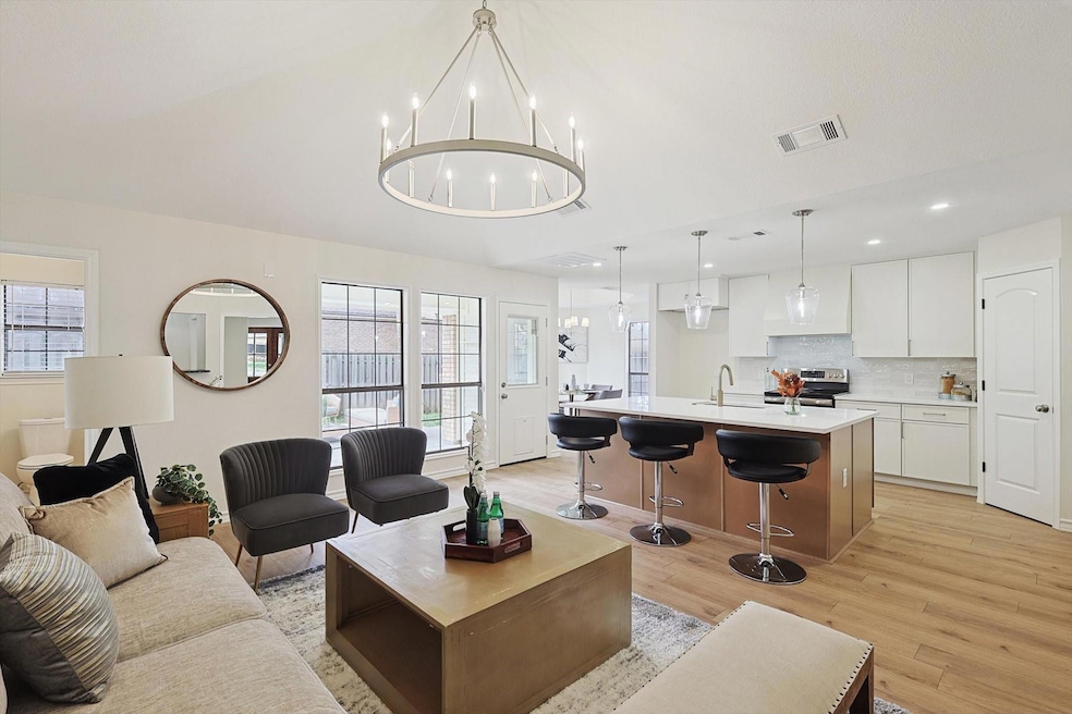 Family room open to the kitchen featuring lofted c