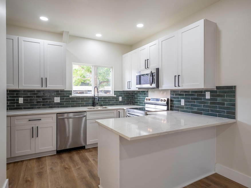 Kitchen featuring appliances with stainless steel