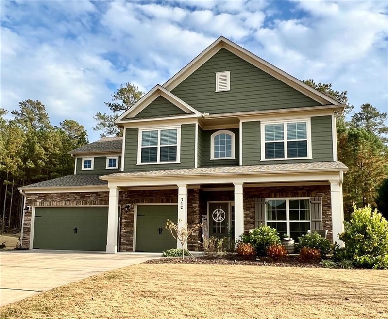 Craftsman inspired home featuring a garage
