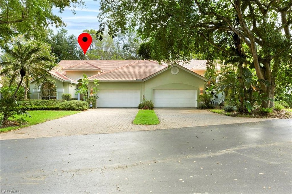 View of front of property with a tile roof, paver 