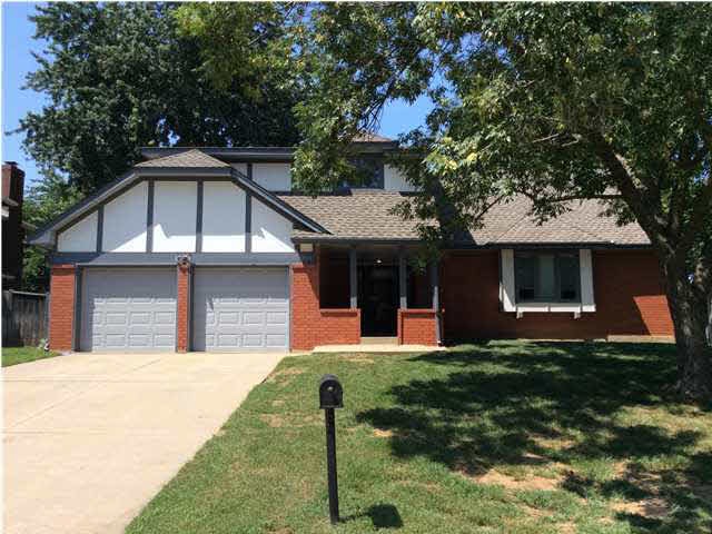 Low maintenance concrete siding and brick home wit