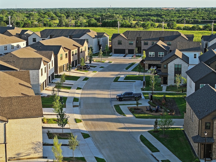 Aerial view of residential area featuring a heavily wooded area