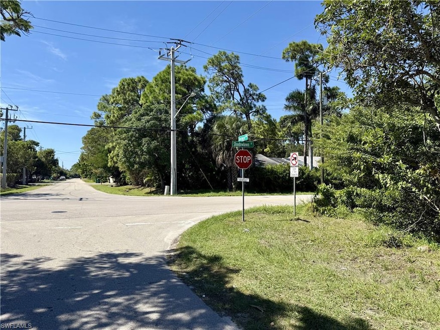 View of asphalt street with traffic signs
