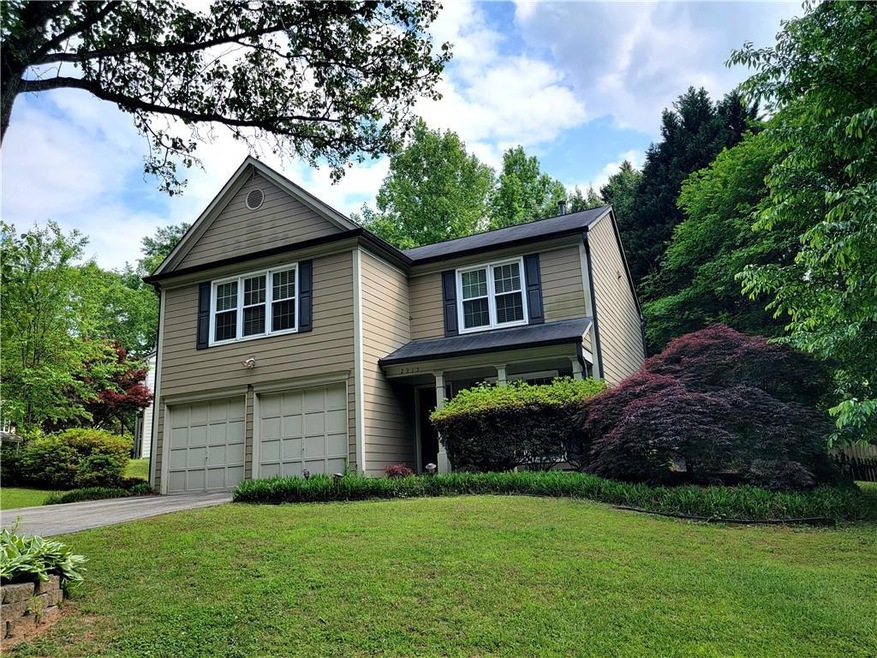View of front of property with a garage and a fron