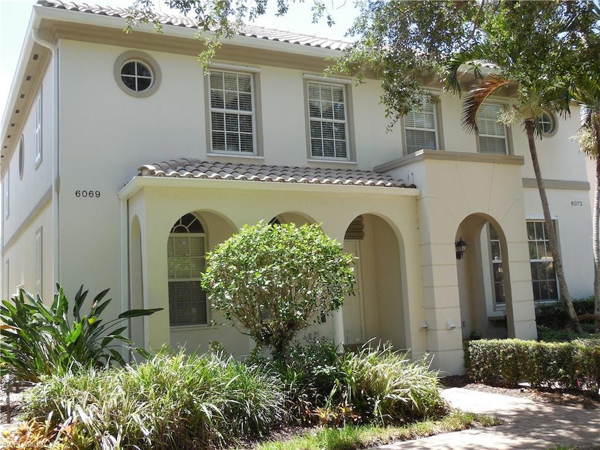 Mediterranean / spanish home featuring a tile roof and stucco siding