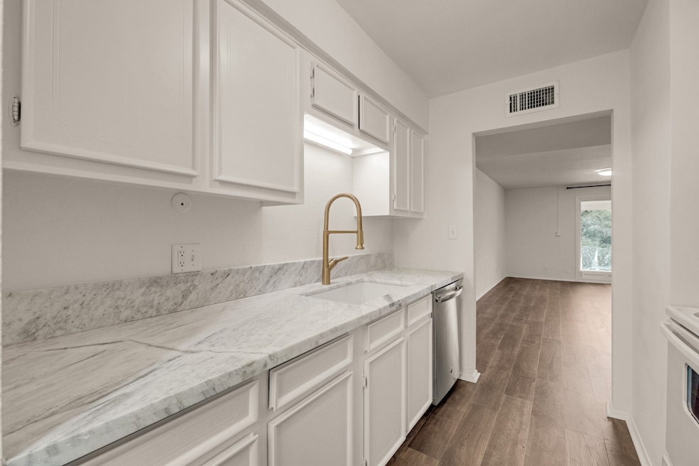 Kitchen offers freshly painted cabinets.