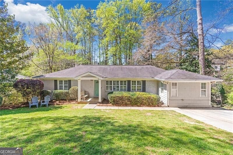 Ranch-style home featuring a front yard