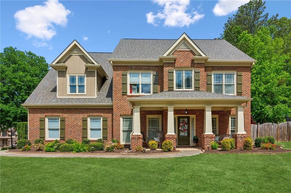 Craftsman-style house featuring brick siding and a
