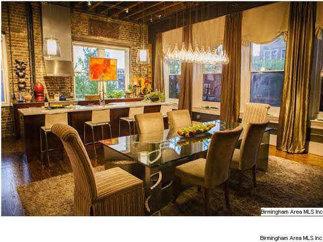 Dining view into the kitchen. What great raw brick