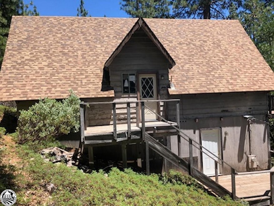 Back of property featuring a wooden deck