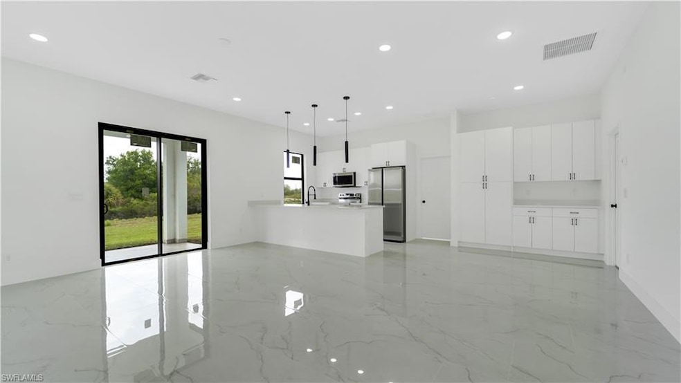 Unfurnished living room featuring recessed lightin