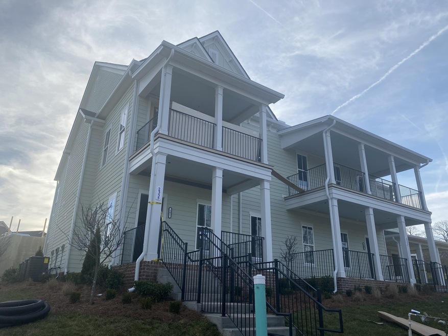 Enjoy your view of the trees from this fantastic covered front porch!