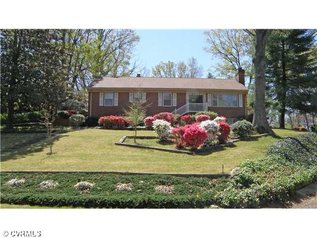 Exterior Front - Located on half an acre, corner l