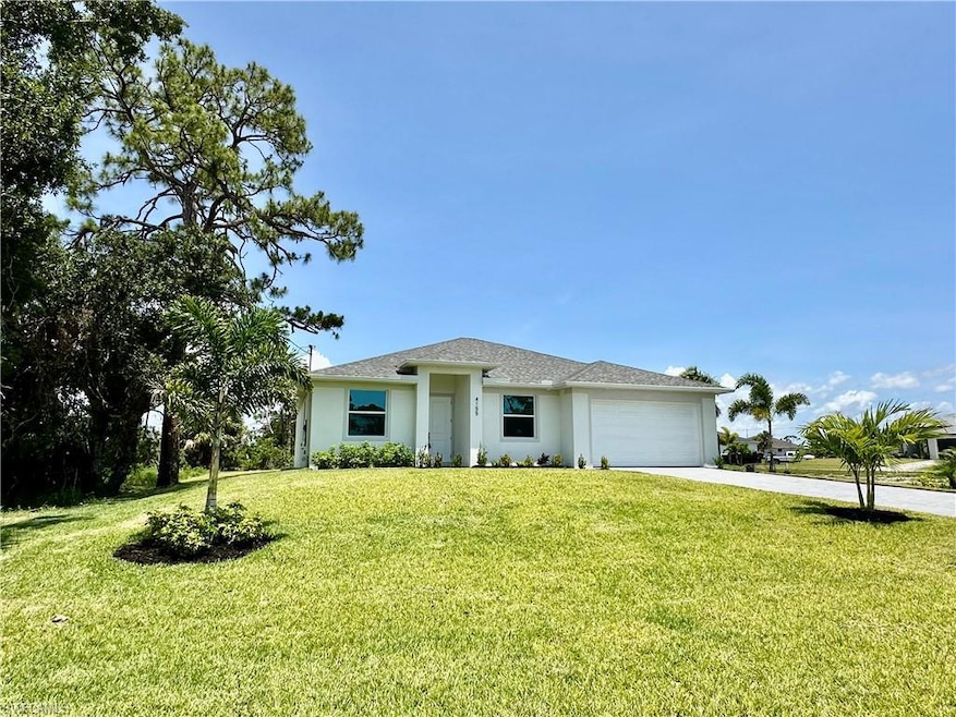 Single story home featuring stucco siding, a garage, roof with shingles, decorative paved driveway, and a front yard