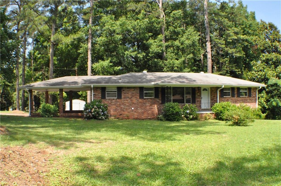 Charming brick ranch with freshly painted trim and