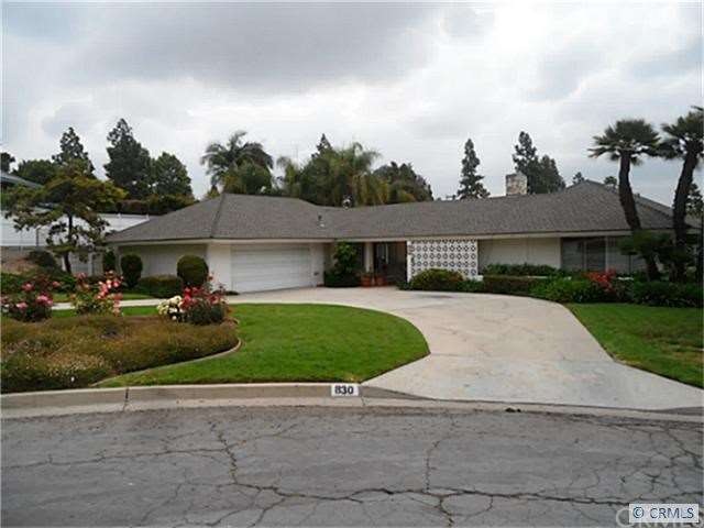 Wrap around driveway w/ doors leading to atrium an