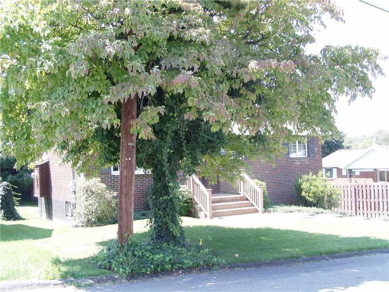Exterior Front. Cute cozy brick ranch, trees, beau