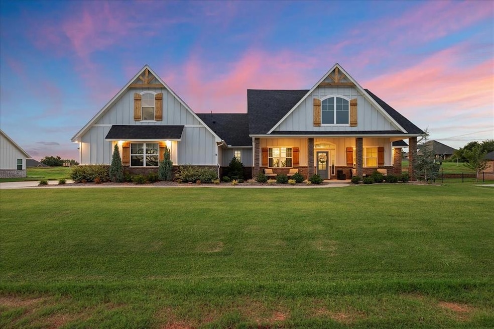 View of front of home featuring a front lawn, cove