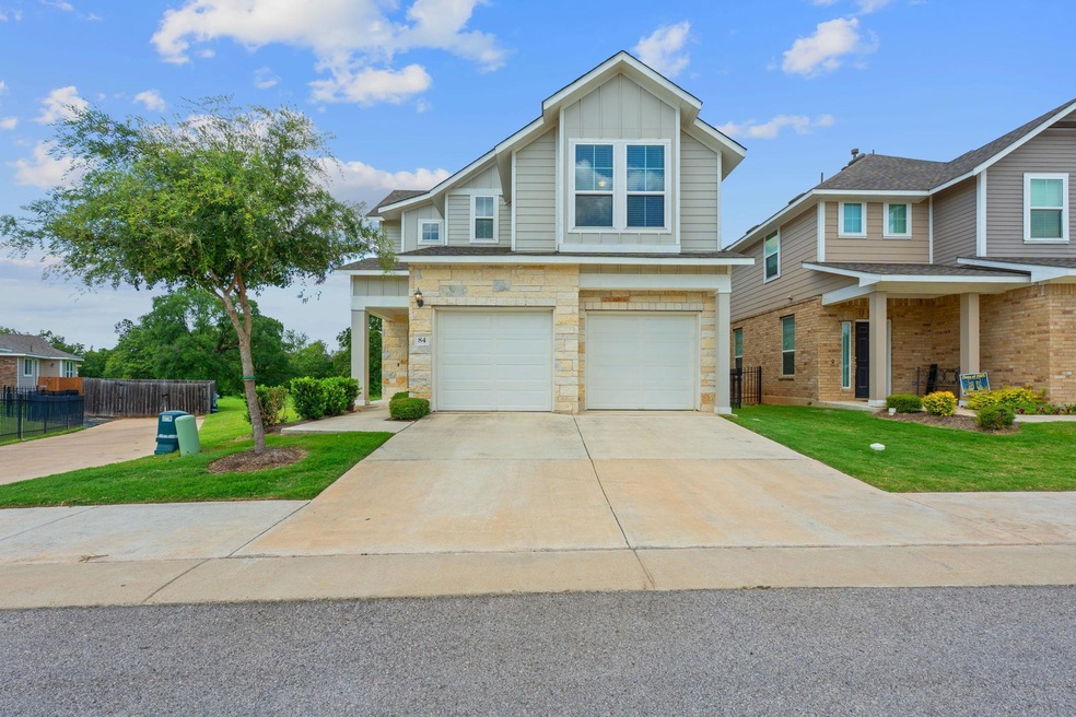 View of front of property with a garage, concrete