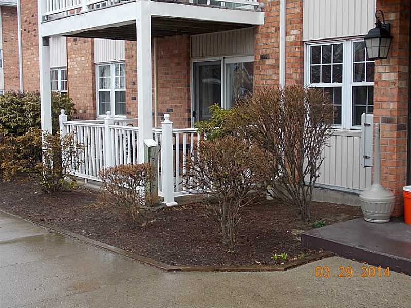 Exterior Front. FIRST FLOOR END UNIT