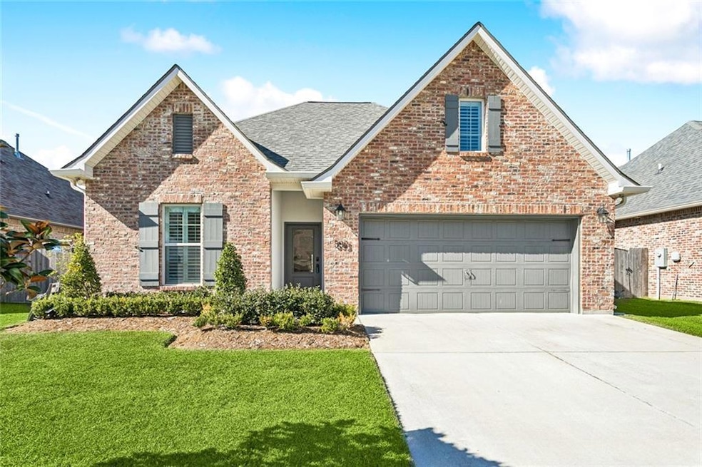 Beautiful brick 4 bedroom AND 3 bath home in inviting Alexandria Ridge Subdivision.