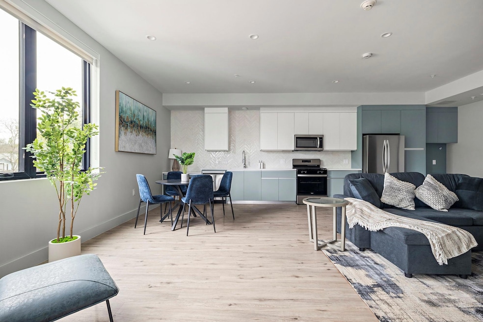 Living room with light wood-style floors and rece