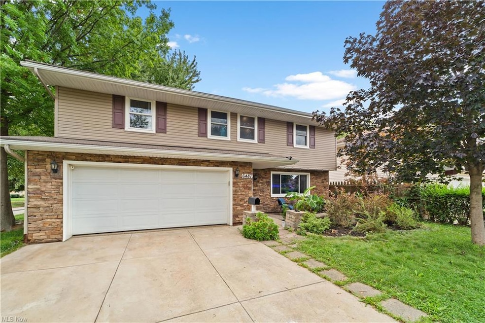 View of property featuring garage