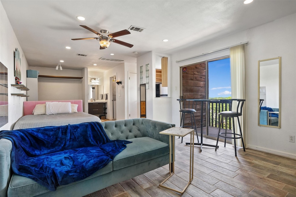 Bedroom with wood finished floors, recessed light