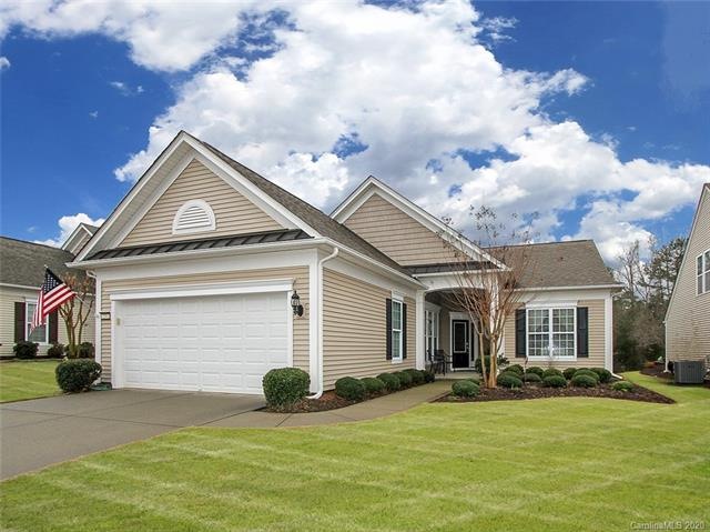 Front of the home with established landscaping.
