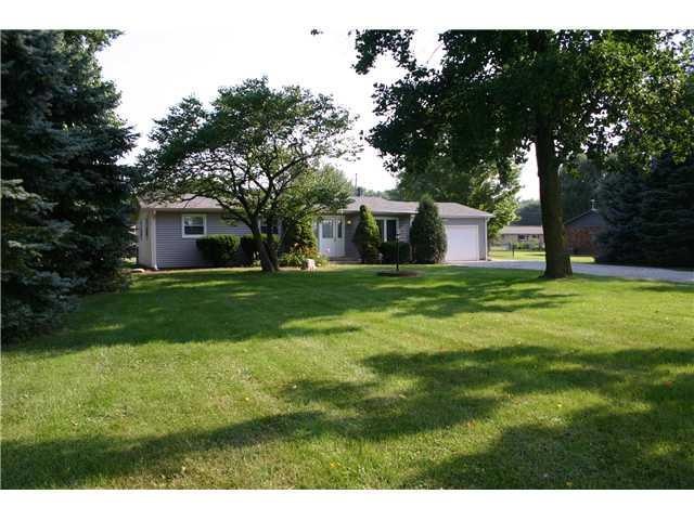 Exterior Front. Rural country set on over a half acre close to everything, new siding, roof and windows.