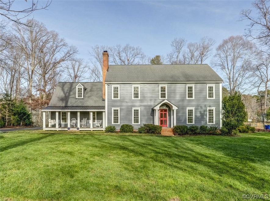 View of front of property with a front lawn