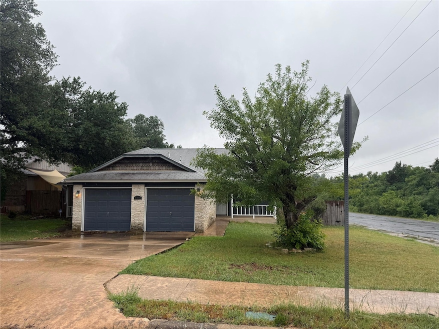 Single story home featuring driveway, an attached