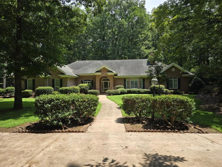 Beautiful 4 sided brick ranch home nestled among 2