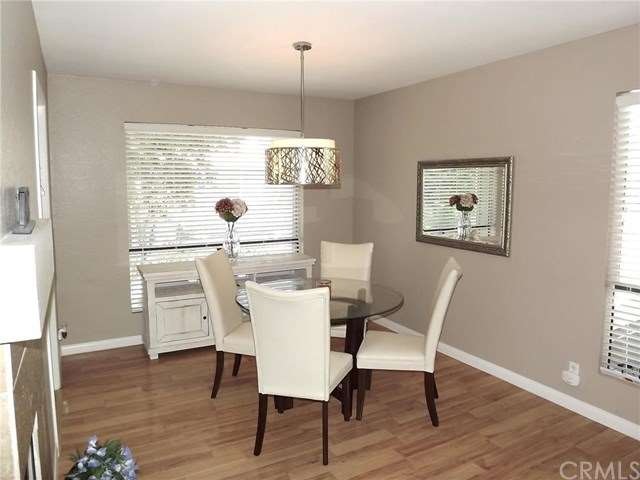 Light laminate wood floors, upgraded baseboards an