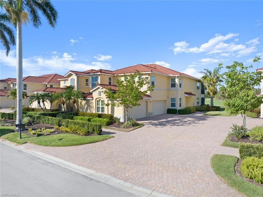 Mediterranean / spanish house featuring stucco siding, a residential view, an attached garage, and decorative driveway