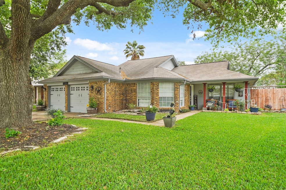 Charming ranch-style home featuring a lush, beauti
