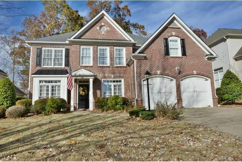 Exterior Front. 4-side brick water table located i