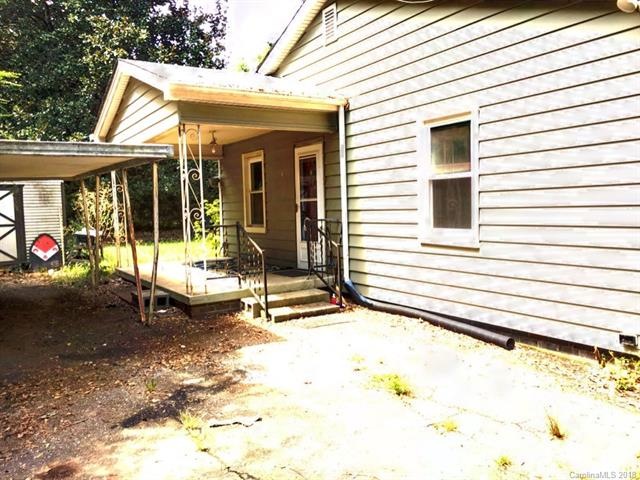 Side Porch next to carport and storage shed.