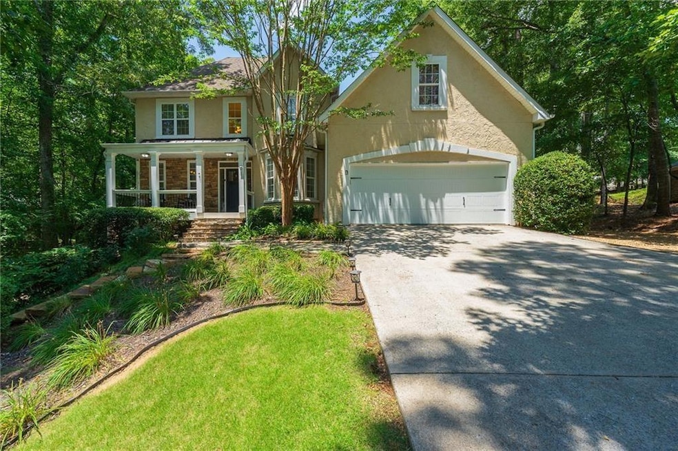 View of front of property with covered porch, a fr