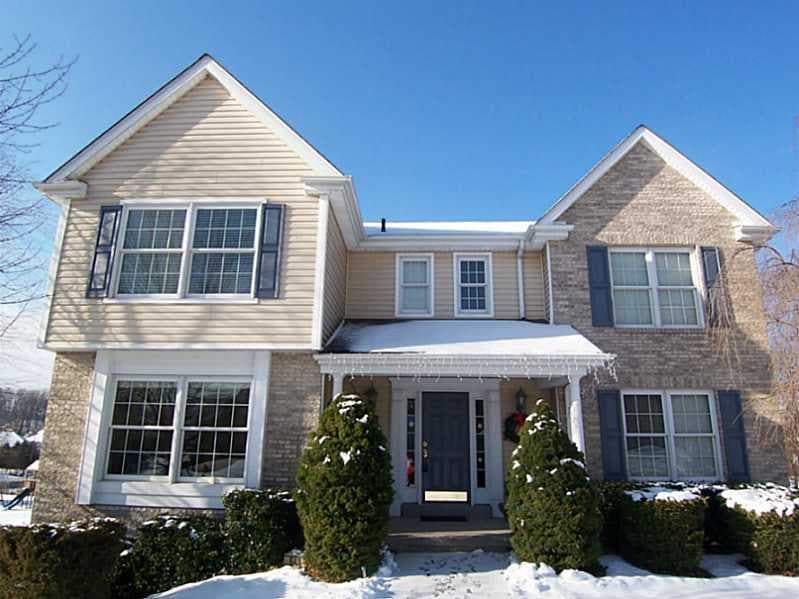 Exterior Front. Covered entry and no maintenance b