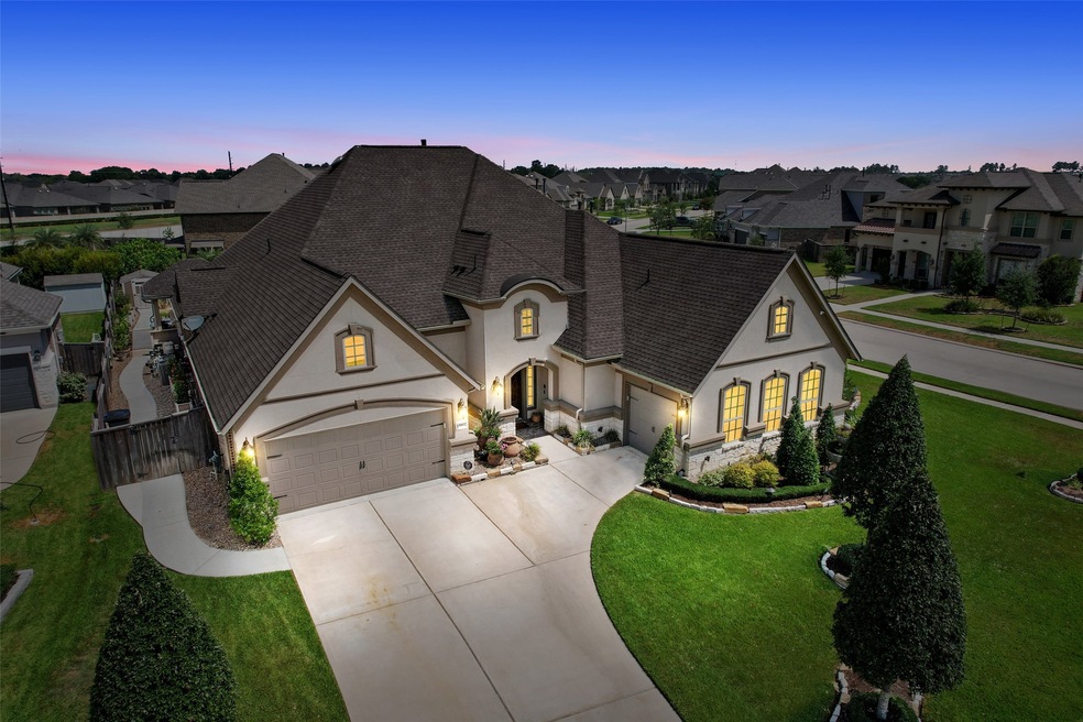 13902 Cotton Bluff Lane in Tomball. One story, 4 bedrooms, two garages (3 car total).