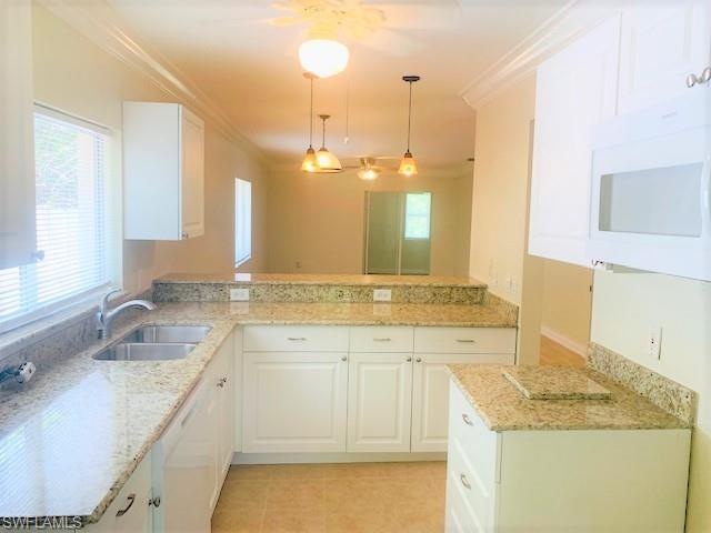 Granite kitchen with white cabinets